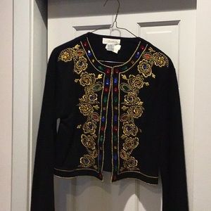 Topper with beautiful embroidery and different colored beads lining the opening.